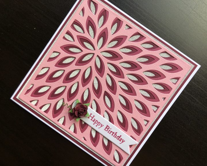Hand made birthday card with layered die cutting and paper rose embellishment