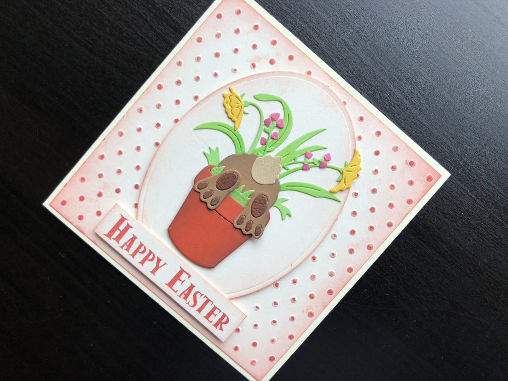 Hand made Easter card with a bunny rabbit in a flower pot.