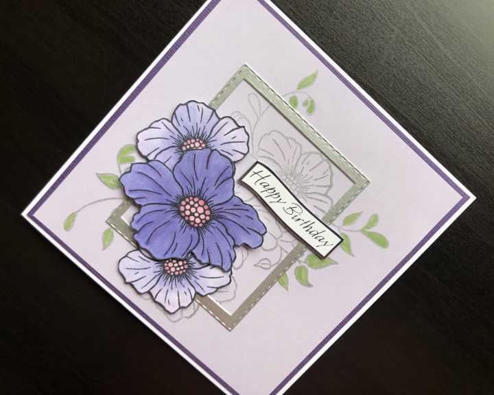 Hand made birthday card with stamped flowers and die cut frame