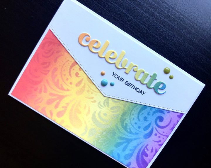 hand made birthday card with inked rainbow and die cut celebrate