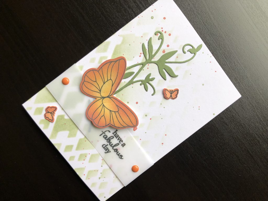 Hand made birthday card with die cut butterfly and stencilled background.