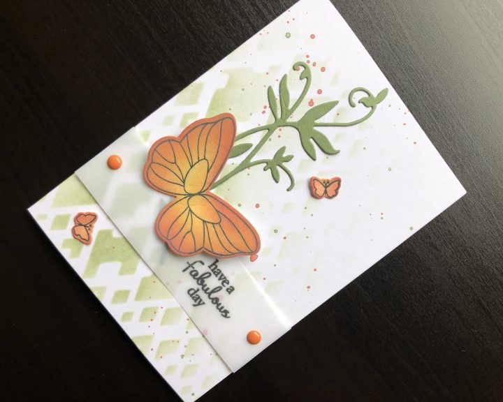 hand made birthday card with die cut butterfly and stencilled background