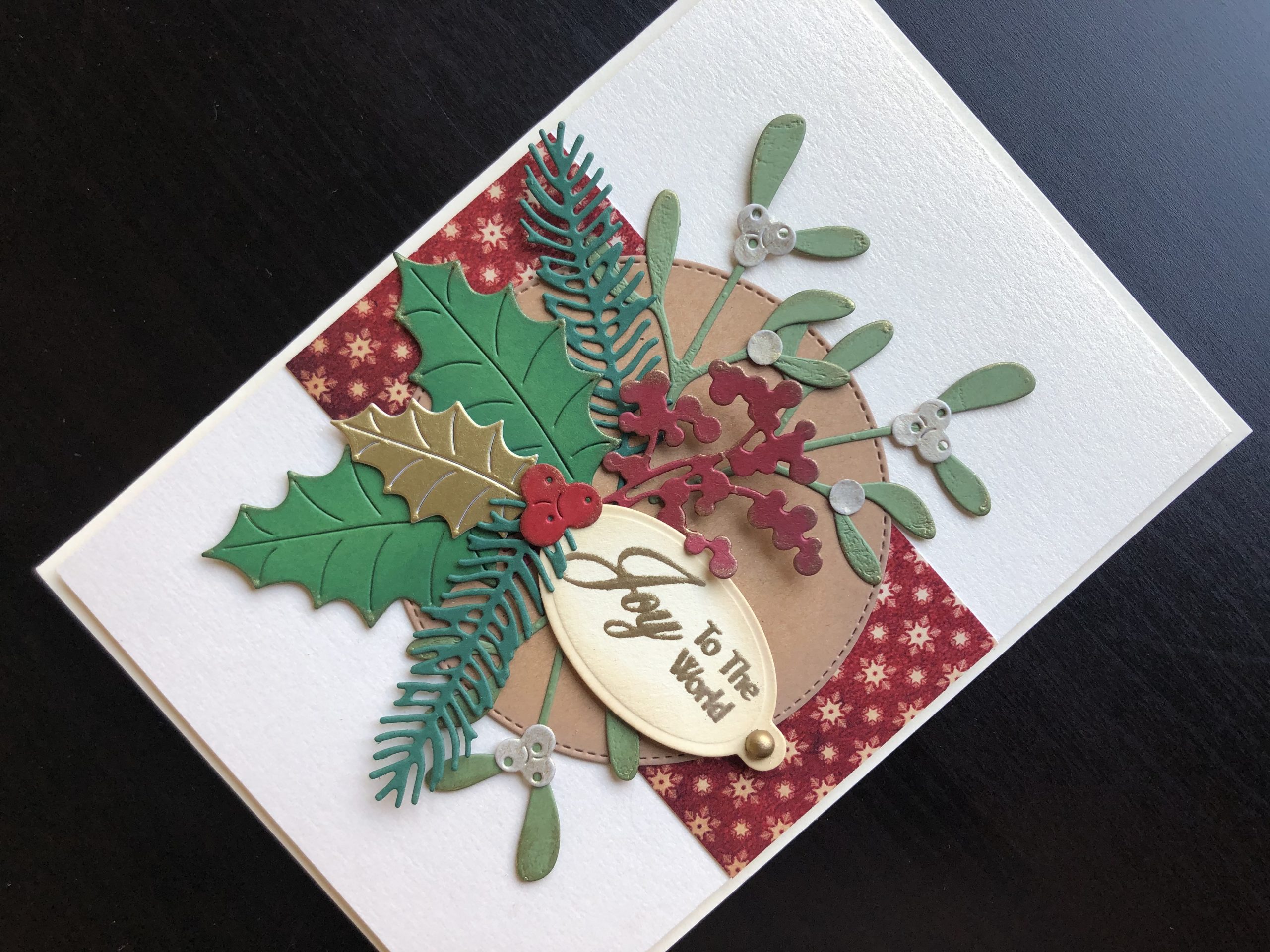 Hand made Christmas card with die cut winter foliage