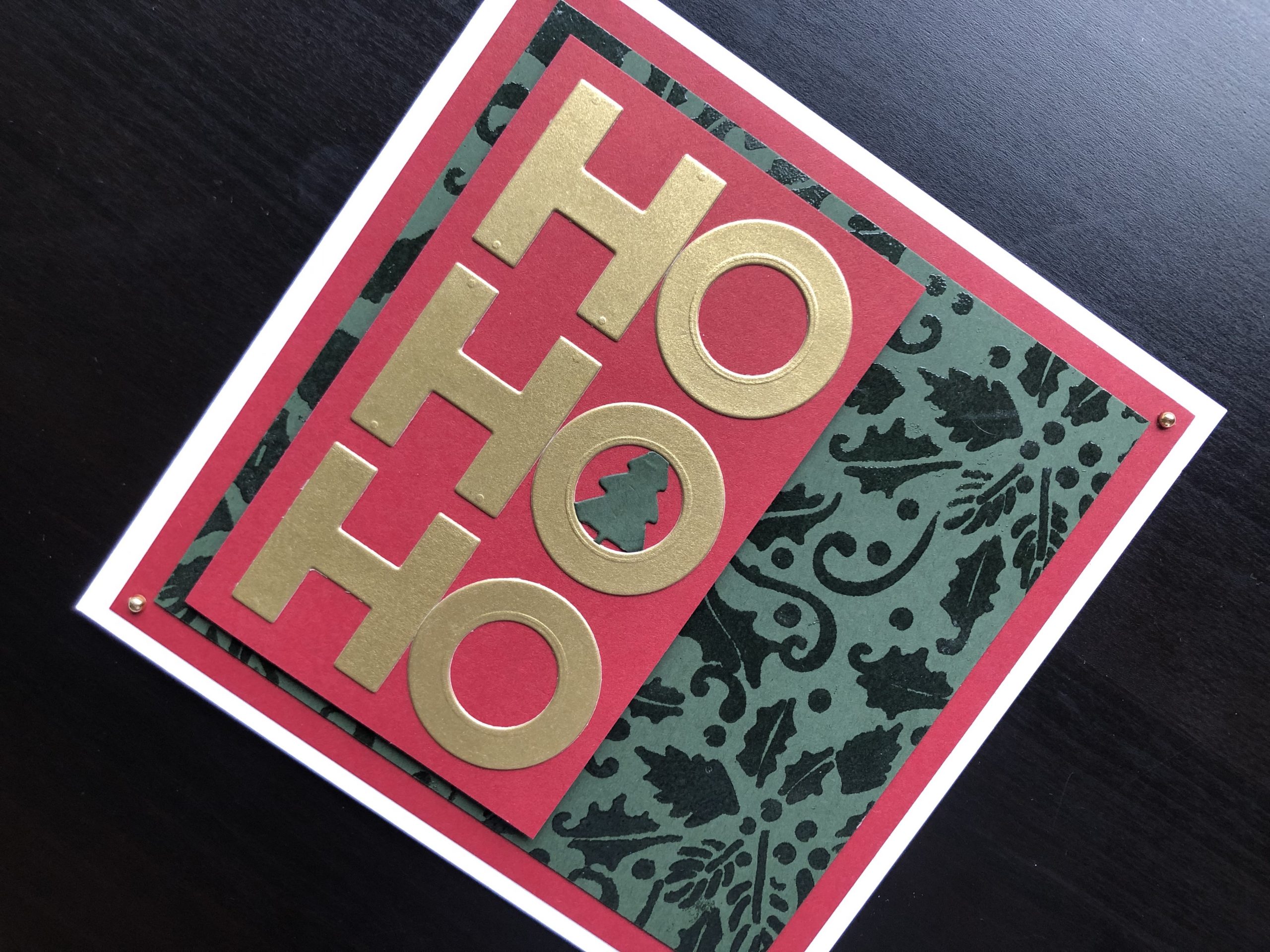 Hand made christmas card with stencilled background and die cut Ho Ho Ho