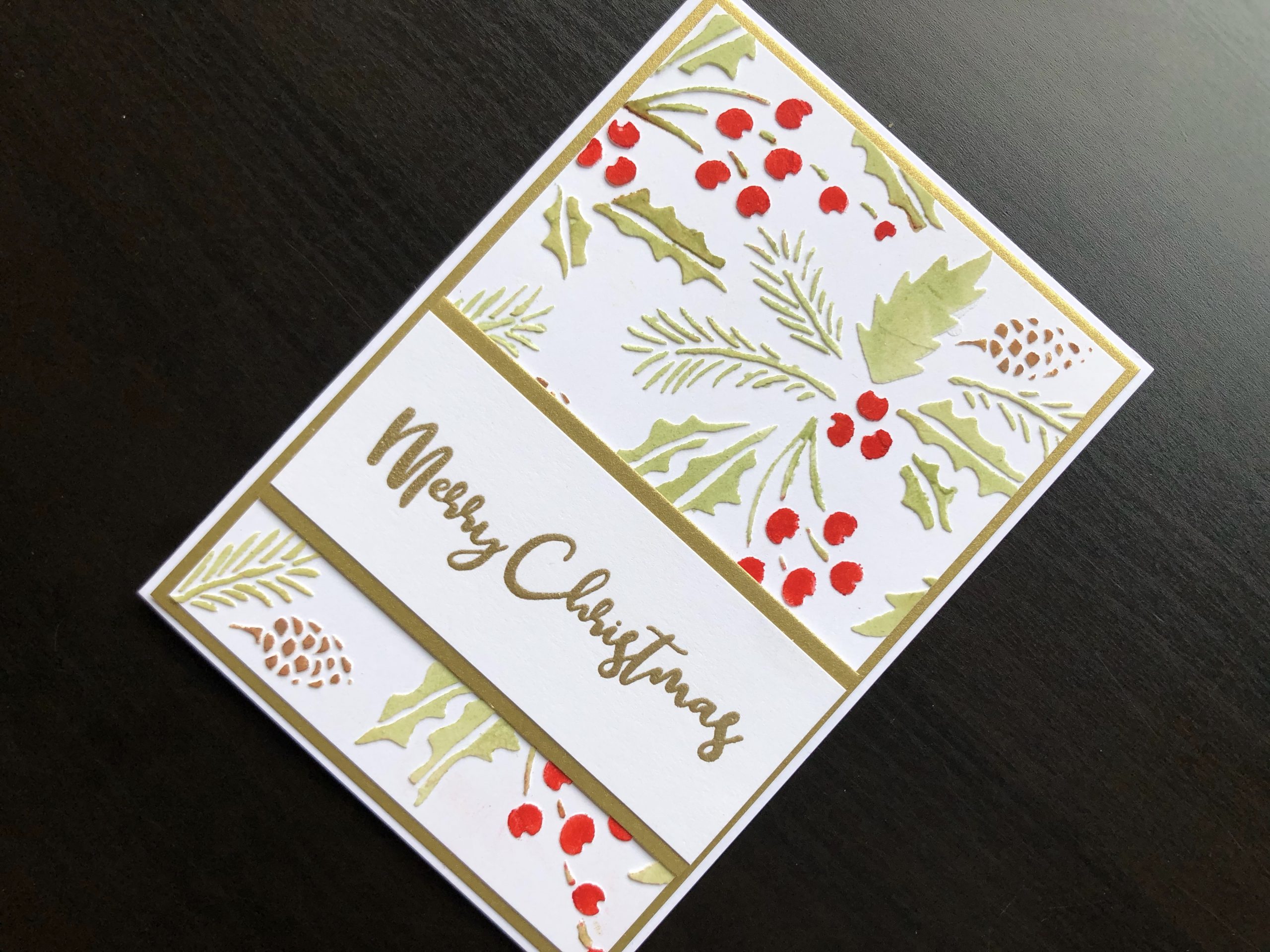 Hand made Christmas card with stencilled texture paste background