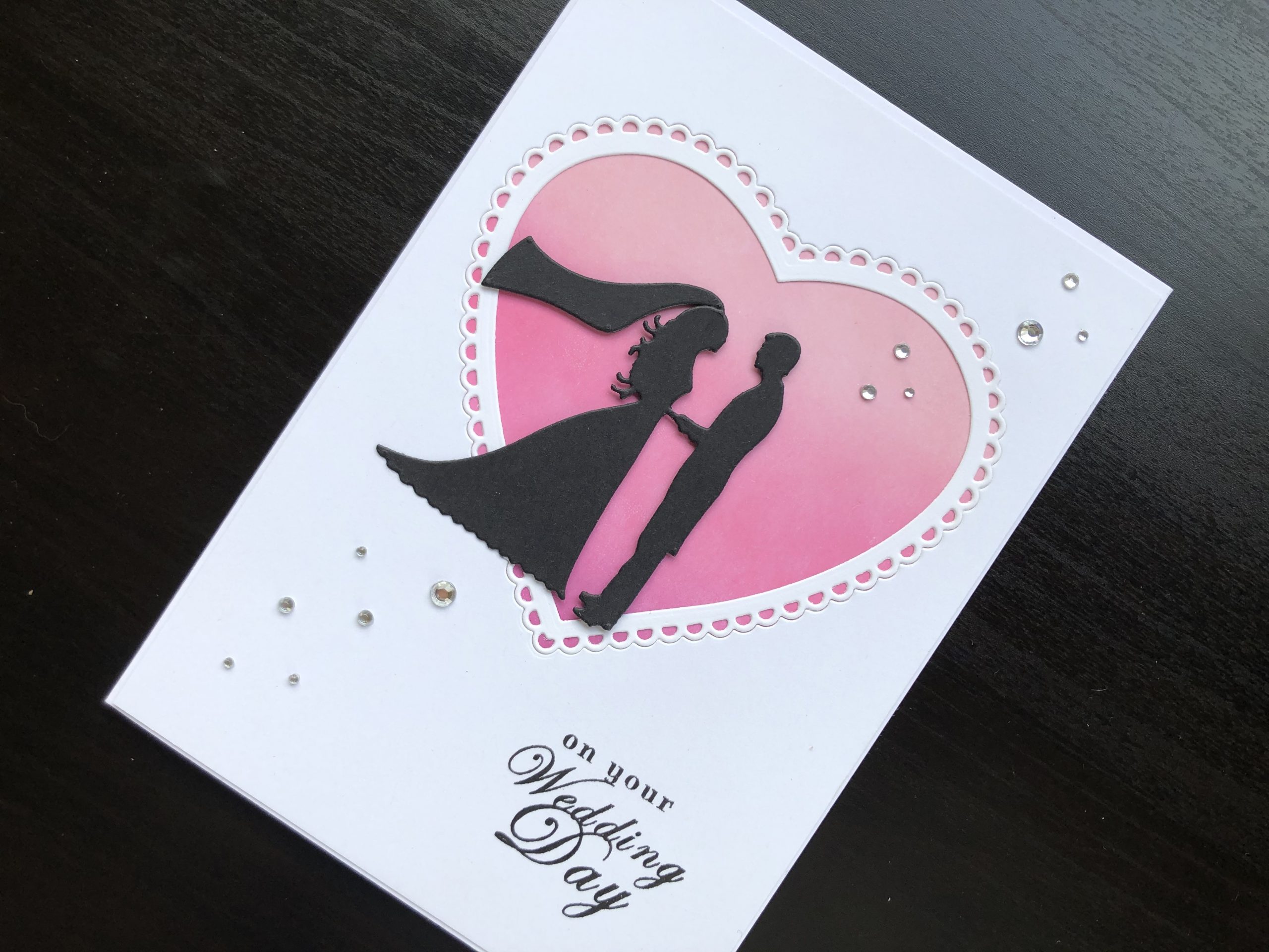 hand made wedding card with die cut silhouette bride and groom and inked heart