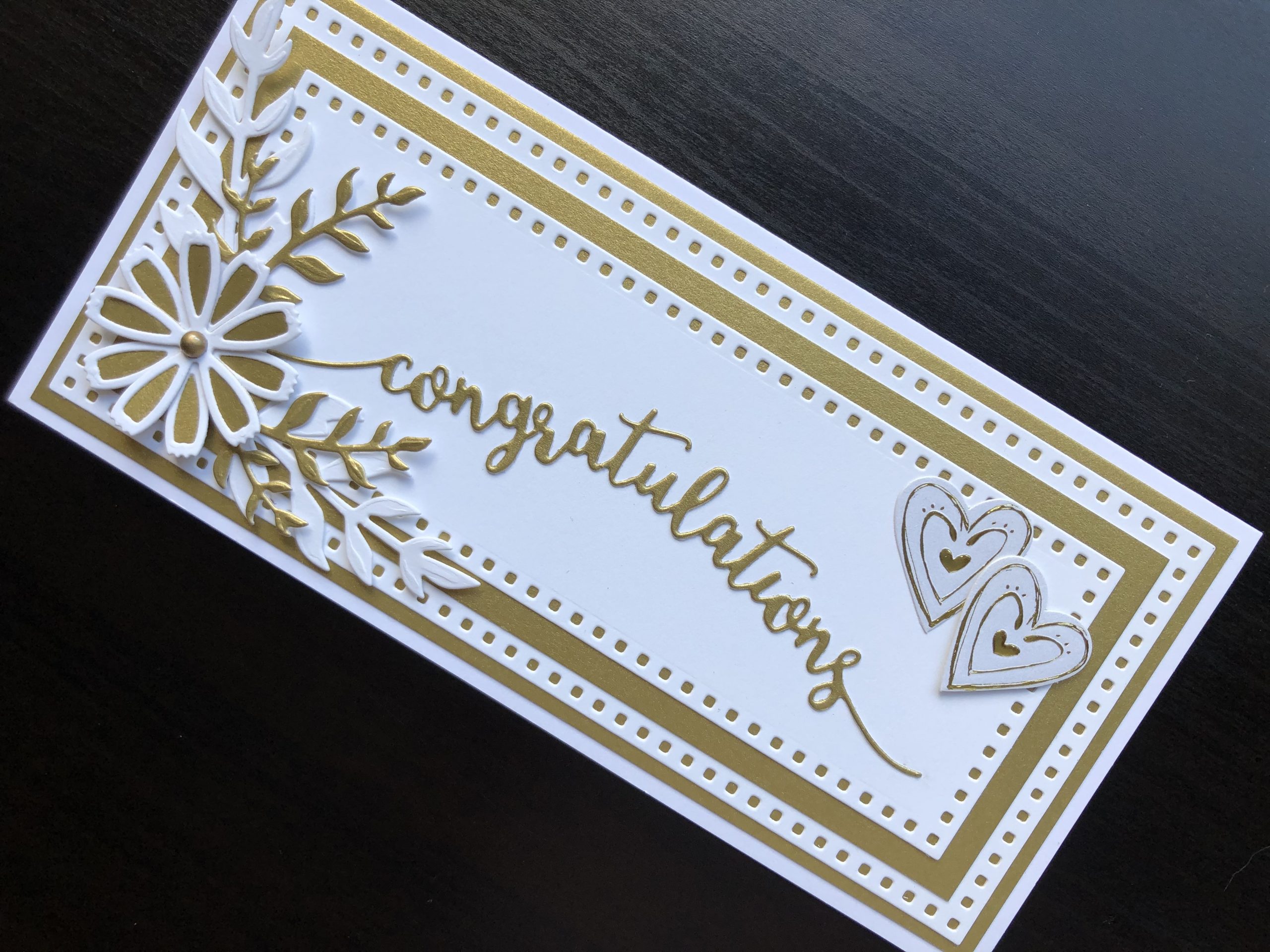 Hand made wedding card with die cut layers, flowers and sentiment.