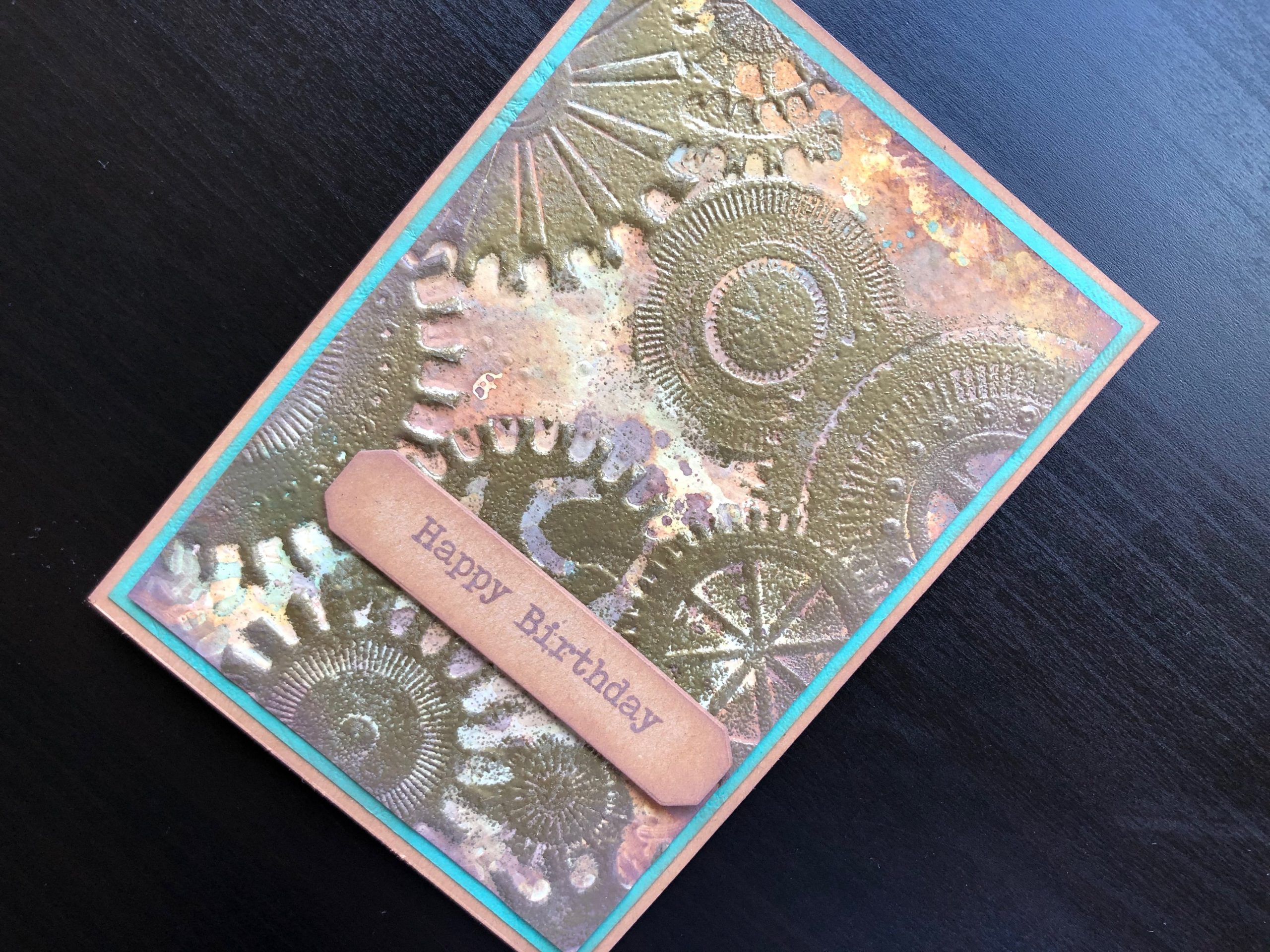 Hand made birthday card with distress oxide background and double embossed cogs
