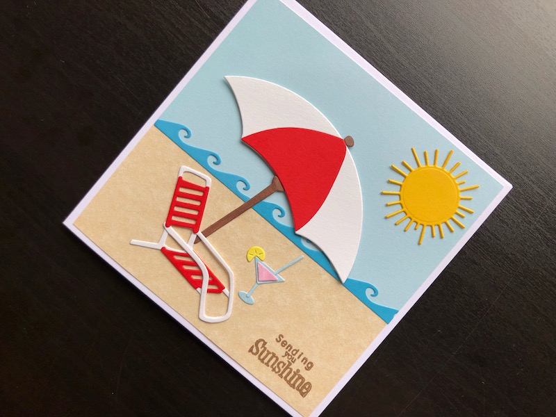 Hand made card with die cut sunshine beach scene