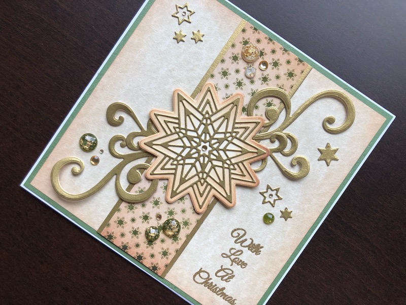 Hand made Christmas card with die cut stars and flourishes