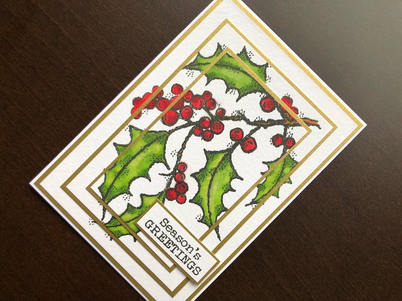 hand made Christmas card with triple layer stamped holly spray
