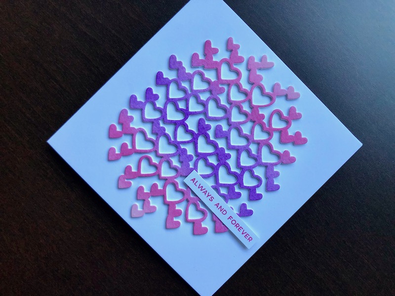 Hand made Valentine card with die cut hearts background