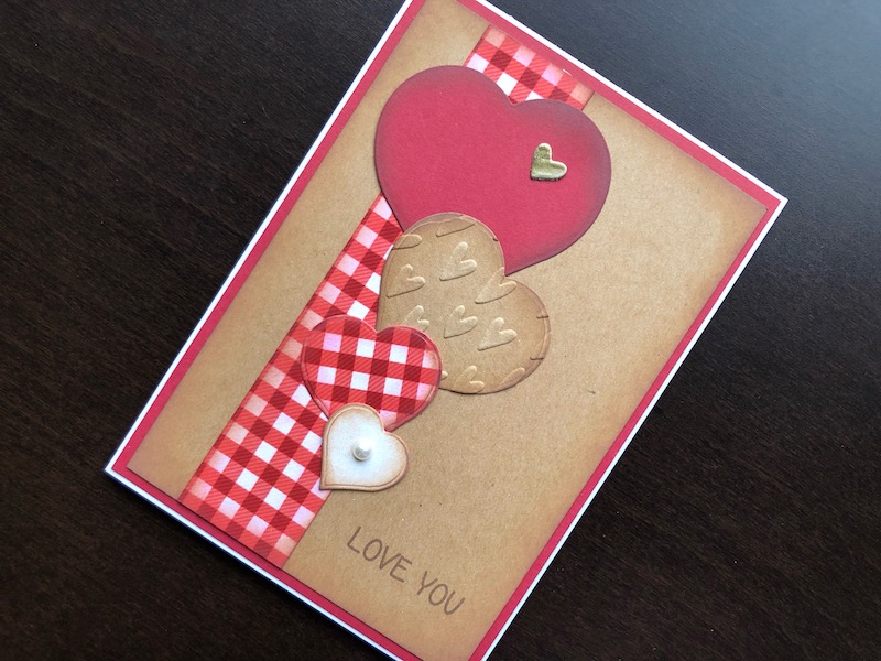 Hand made Valentine card with die cut hearts in rustic style