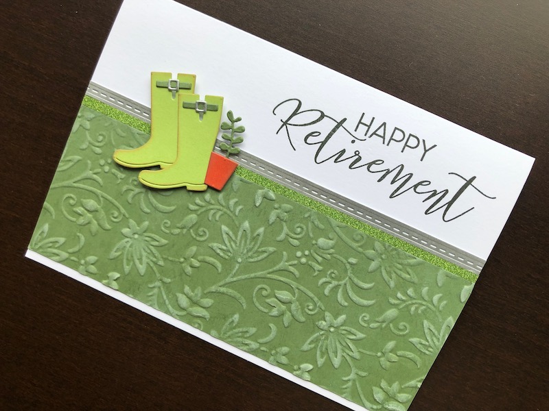 Hand made retirement card with embossed background, die cut wellingtons and stamped sentiment