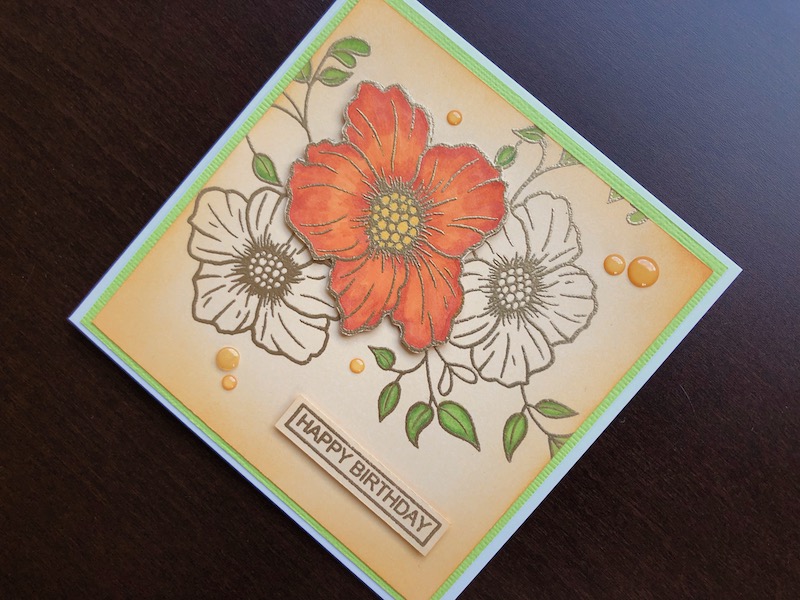 Hand made birthday card with stamped and heat embossed flowers and sentiment
