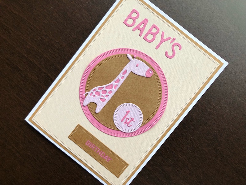 Hand made baby's first birthday card with die cut baby giraffe