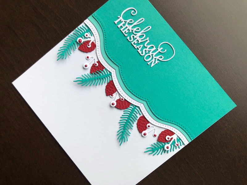 Hand made Christmas card in turquoise red and white with scalloped borders and die cut foliage