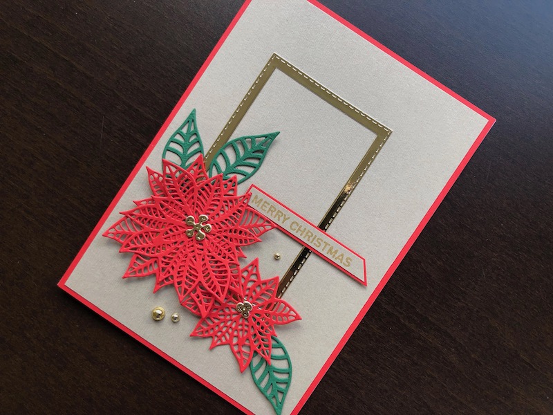 Hand made Christmas card with die cut poinsettias and gold stitched edge frame