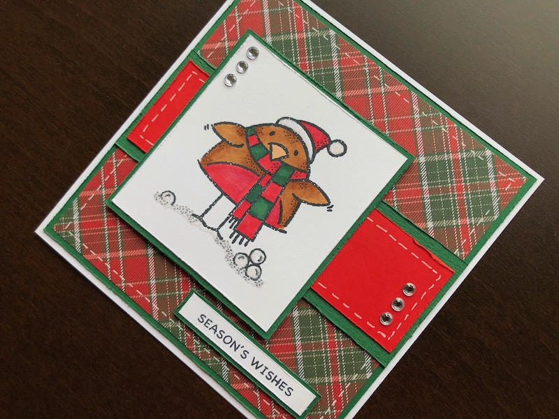 Hand made Christmas card with cute stamped robin and tartan background