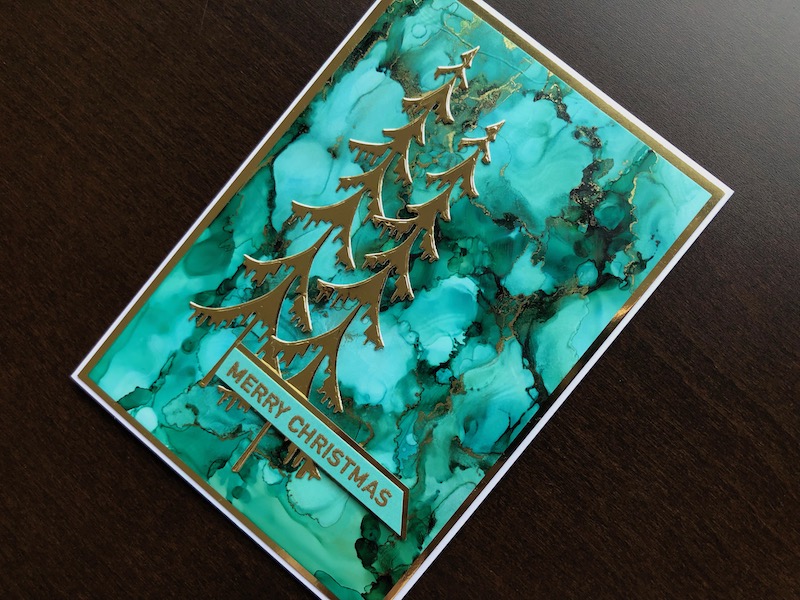 Hand made Christmas card with alcohol ink blended background and die cut Christmas trees