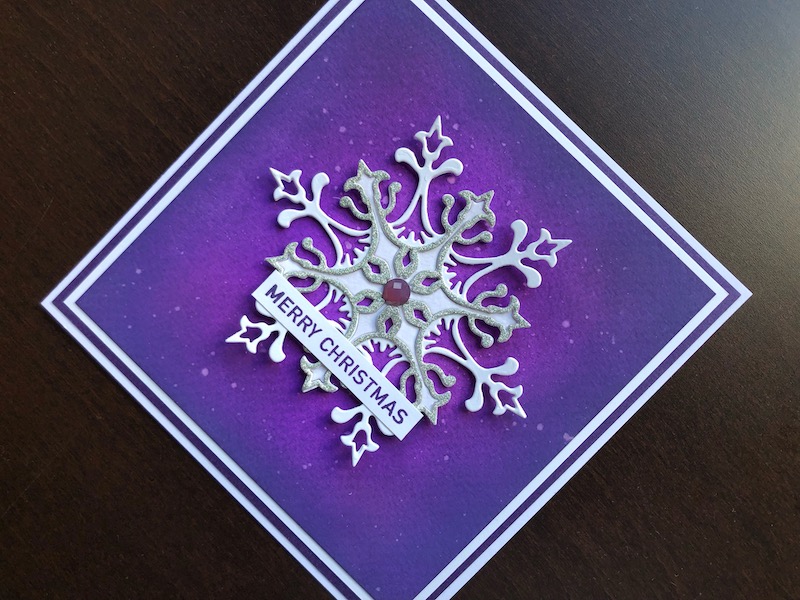 Hand made Christmas card with inked background and die cut snowflake