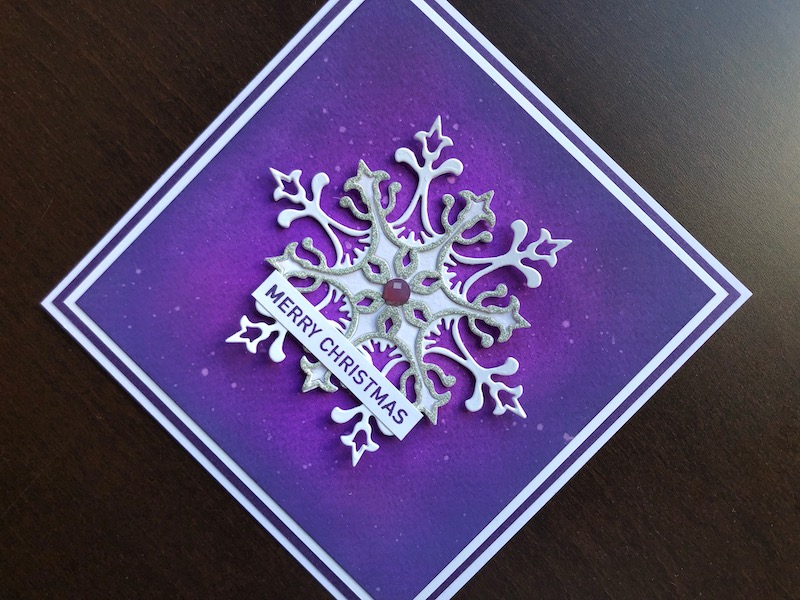 Hand made Christmas card with inked background and die cut snowflake