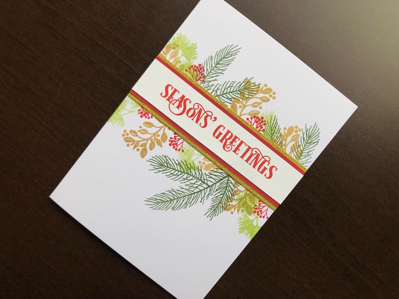 Hand made Christmas card with stamped foliage and berries