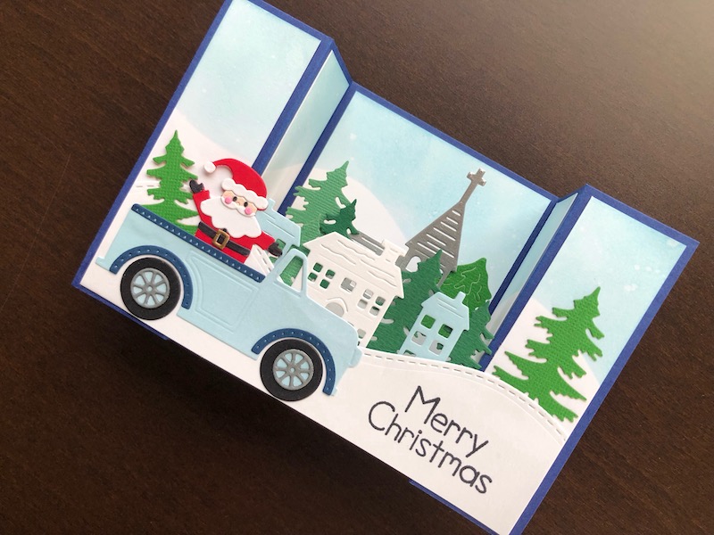 Hand made U Fold Bridge Christmas card with Santa in a car