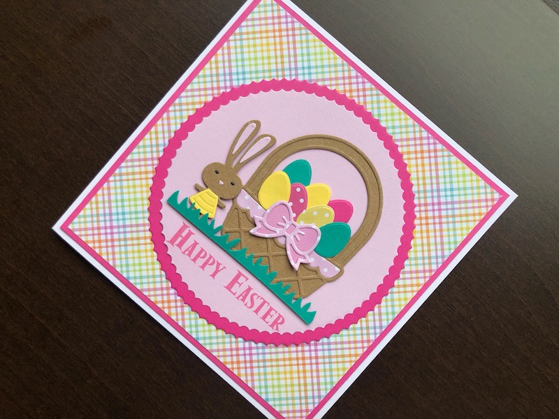 Hand made Easter card with a die cut Easter bunny and basket of eggs.