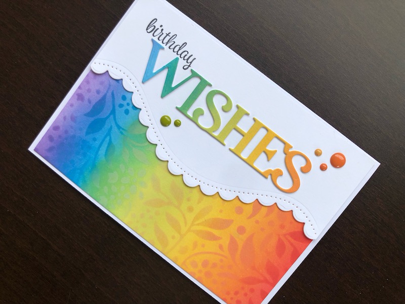 Hand made birthday wishes card with inked rainbow and stamped and die cut sentiment.