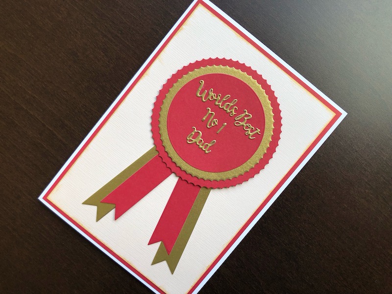 Hand made Father's Day card with World's Best die cut rosette.