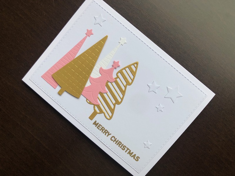 Hand made Christmas card with modern style pink and gold Christmas trees, stars and heat embossed gold sentiment