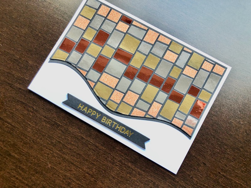 Hand made birthday card using the scrappy strips mosaic technique with glitter and mirror card, and hot foiled happy birthday sentiment.