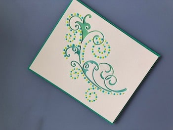 Arching Twirls die cut and decorated with Nuvo Drops