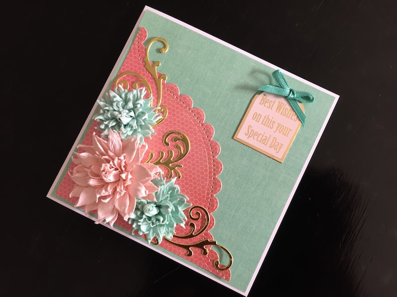 Birthday card with curved border die cut and paper flowers