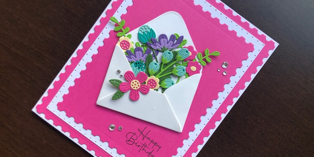 Hand made birthday card with die cut envelope filled with flowers
